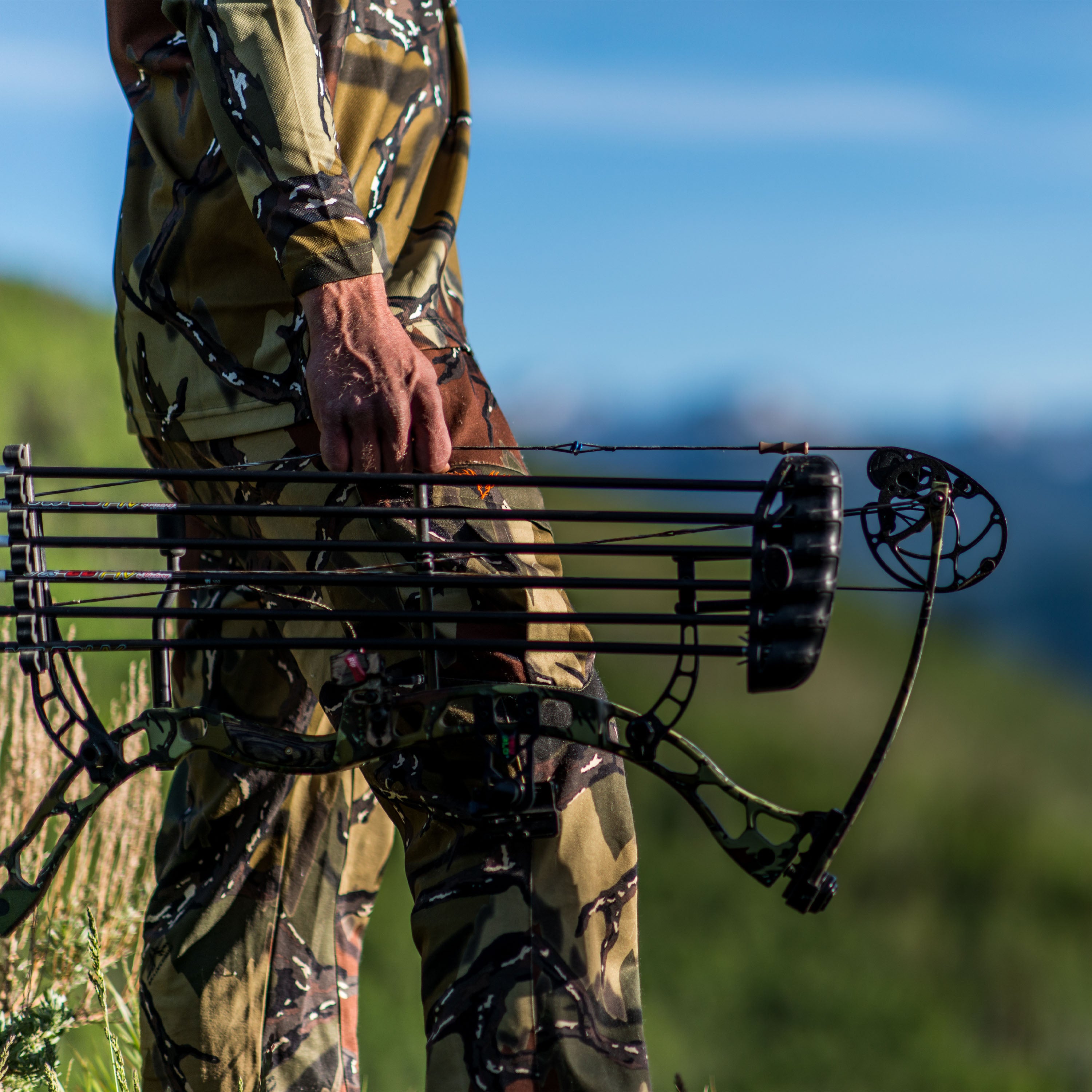Alpine Pant hunter with bow